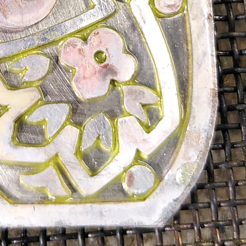 Close up of a piece of jewellery ready to be soldered. It is a floral pattern. Casez Jewellery.